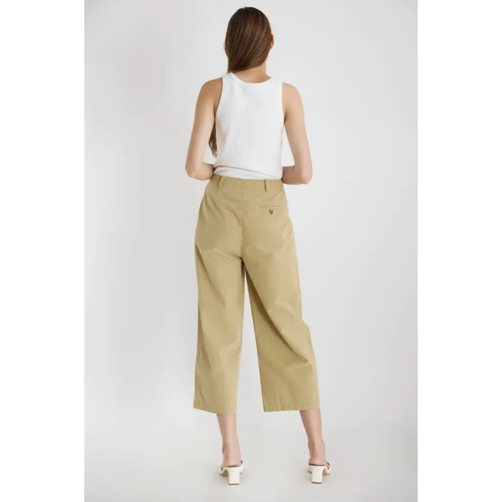 Woman in a white tank top and khaki culottes from The Ivette Basic Tank, stylish womens clothes