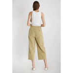 Woman in a white tank top and khaki culottes from The Ivette Basic Tank, stylish womens clothes