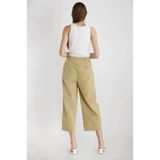 Woman in a white tank top and khaki culottes from The Ivette Basic Tank, stylish womens clothes