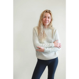 Person rocking the Margo Crew Neck Sweater in light beige with dark leggings