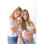 Two women, one pregnant, wearing The Mom Crop boxy tee in Antique White for a stylish mom crop look