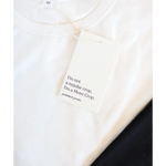 White clothing tag with minimalist text reading I’m not a regular crop, I’m a Mom Crop on Stylish Mom Crop Boxy Tee designed for casual everyday wear