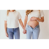 Pregnant woman holding hands in The Mom Crop boxy tee Stylish Mom Crop in Antique White