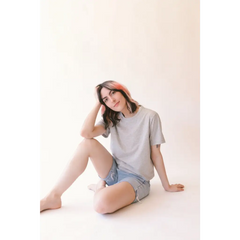 Woman in gray mom crop top and denim shorts from Stylish Womens Clothes collection