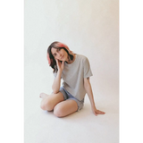 Woman in gray mom crop top and denim shorts from The Mom Crop in Gray, stylish womens clothes