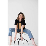 Stylish Mom Crop Boxy Tee paired with a modern black metal and wood stool