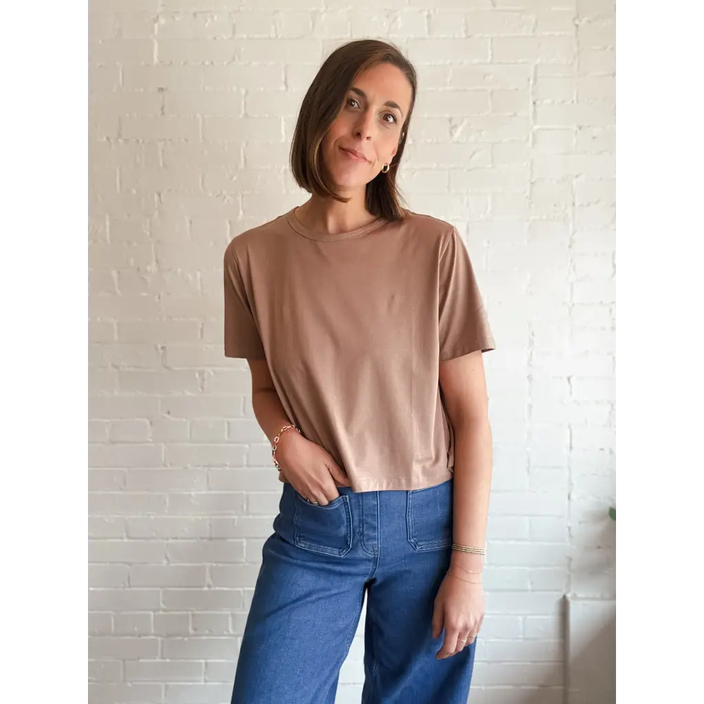 Woman in brown T-shirt and blue pants showing The Mom Crop in Mocha, stylish womens clothes