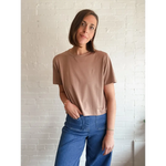 Woman in brown T-shirt and blue pants showing The Mom Crop in Mocha, stylish womens clothes