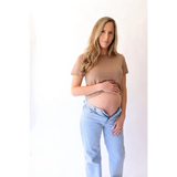 Pregnant woman in The Mom Crop in Mocha showcasing stylish womens clothes and polished prints