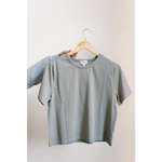 Gray mom crop boxy tee on a wooden hanger for effortless style and comfort