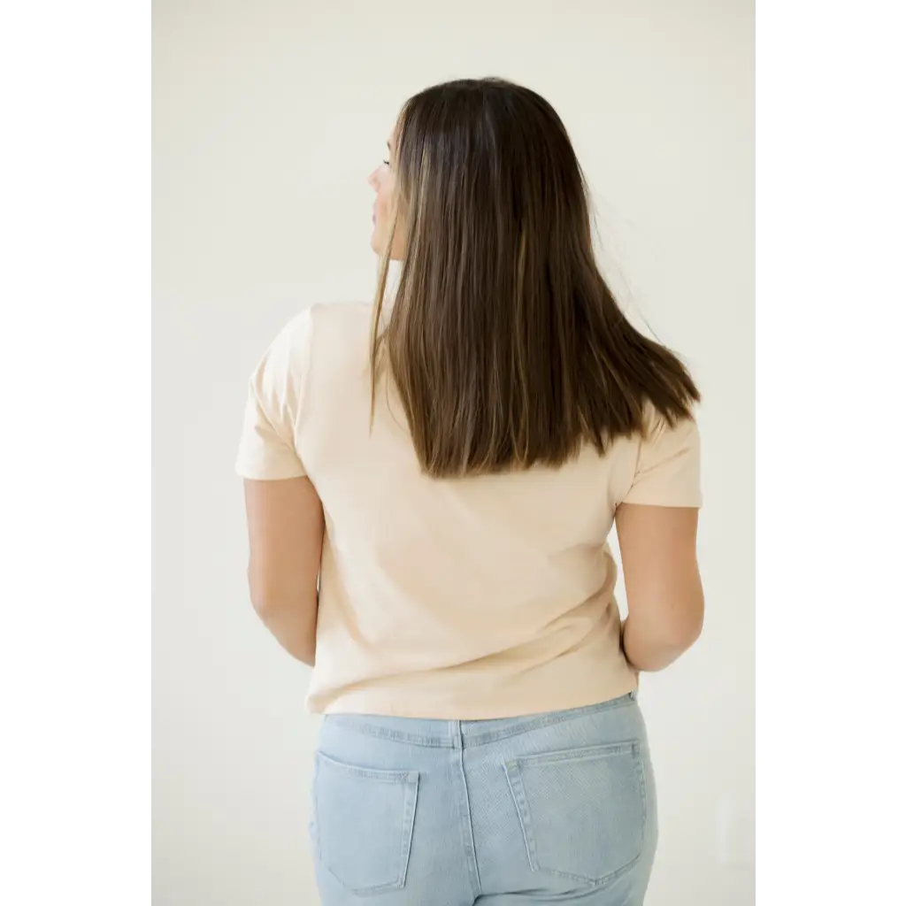 Long straight brown hair paired with a Stylish Mom Crop Boxy Tee against a cream top