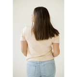 Long straight brown hair paired with a Stylish Mom Crop Boxy Tee against a cream top