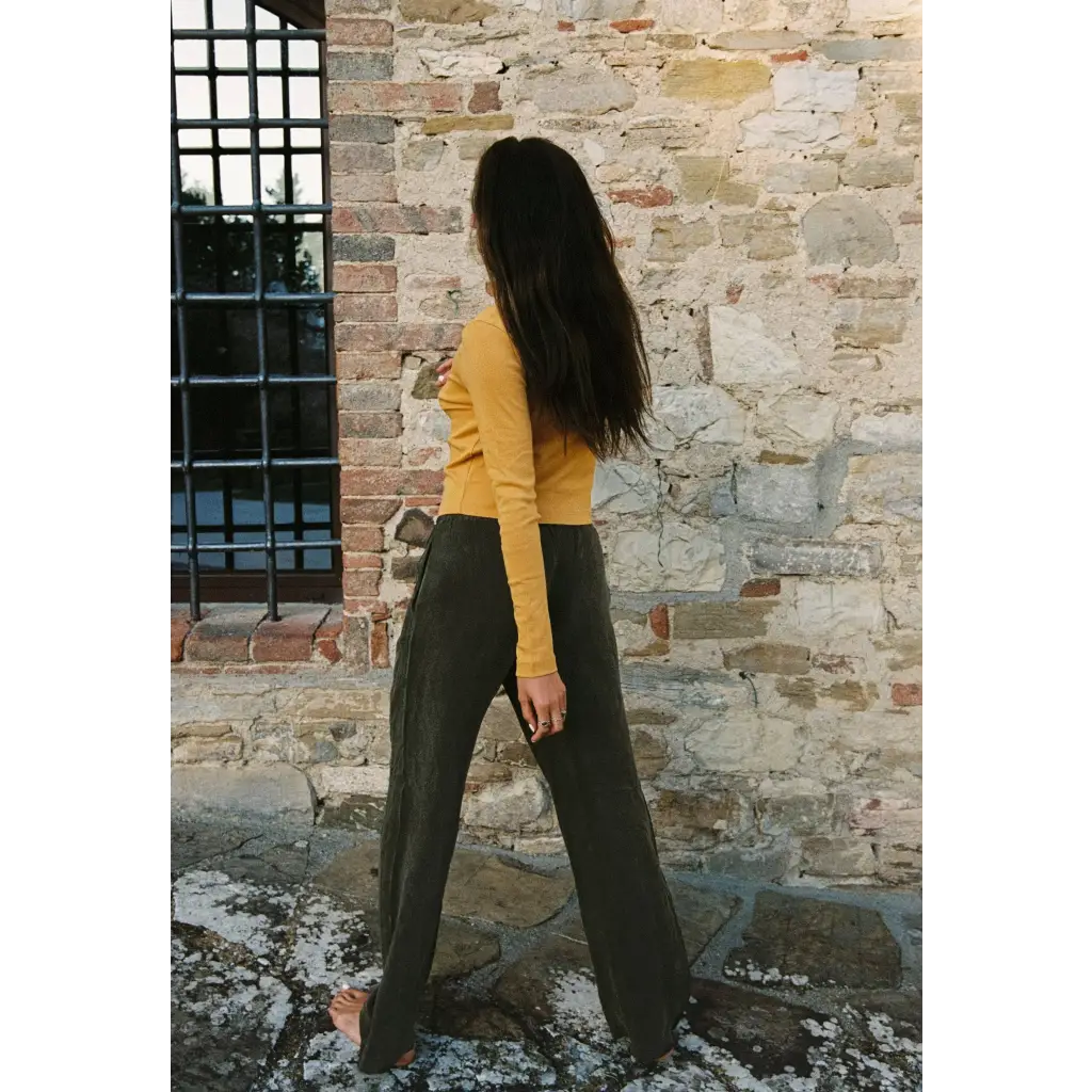 Woman in organic cotton baby rib cardigan with olive trousers