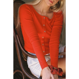 Vibrant orange organic cotton baby rib cardigan front view