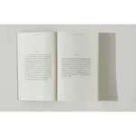 Open book with printed text from Brianna Wiest’s Pivot Year showing polished prints
