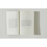 Open book with printed text from Brianna Wiest’s Pivot Year showing polished prints