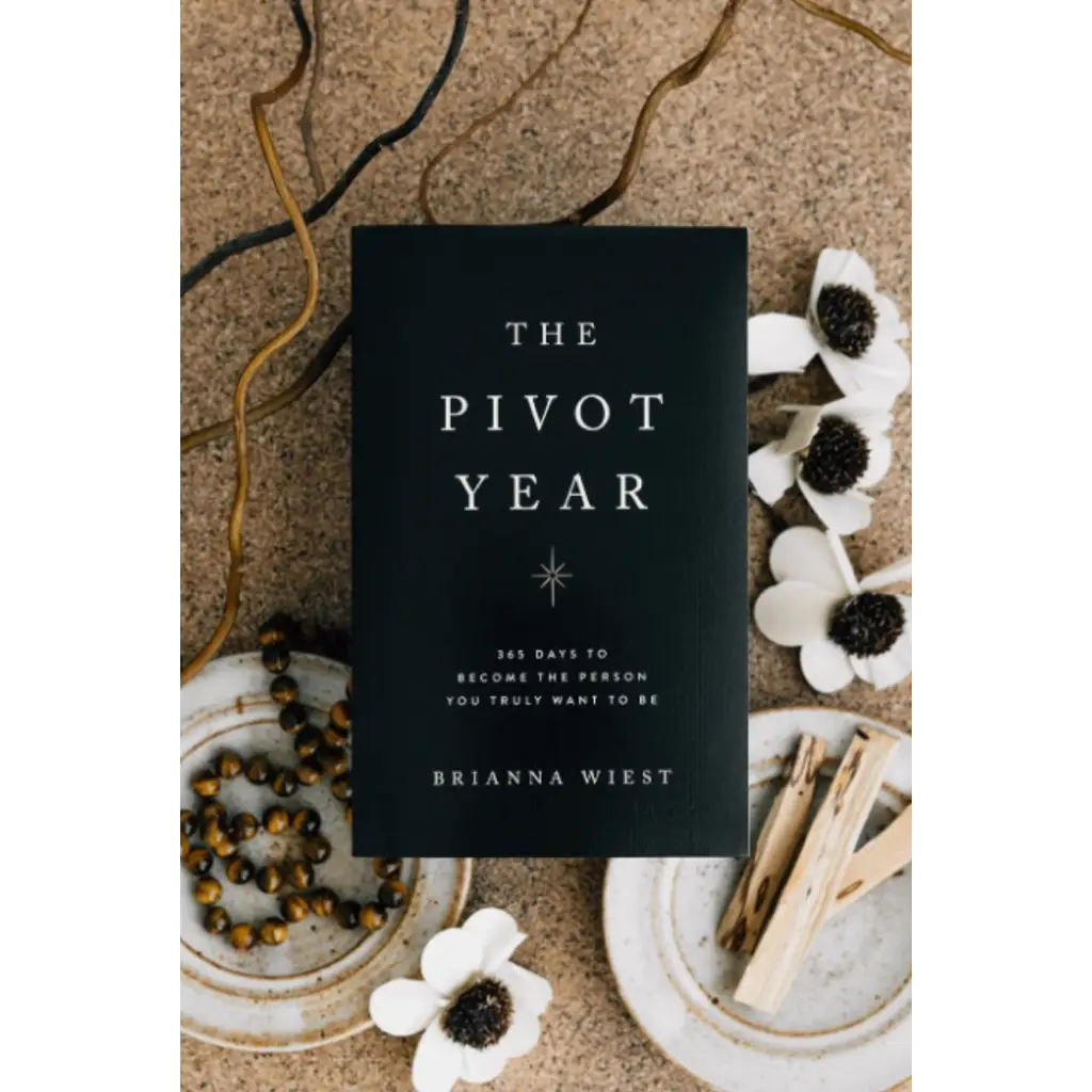 Black book titled The Pivot Year by Brianna Wiest in Polished Prints collection