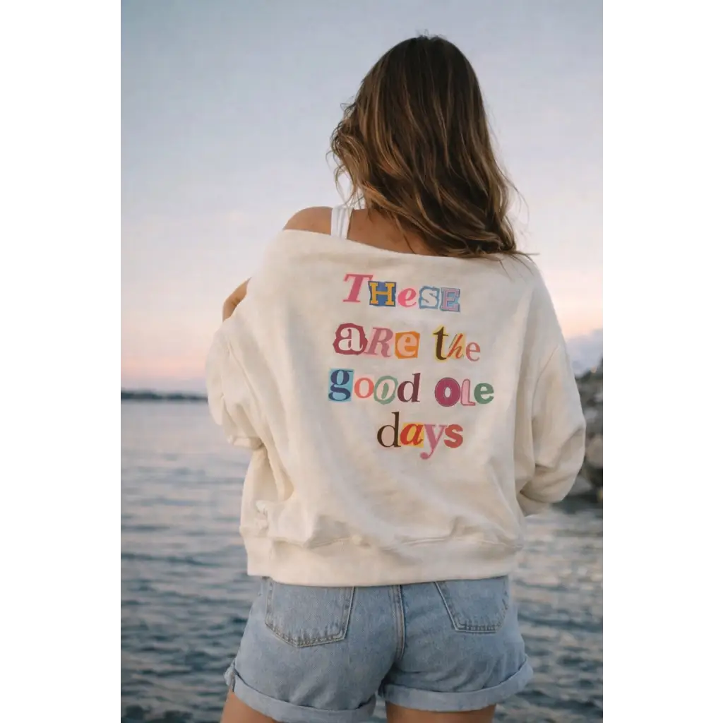 Cream off-shoulder sweatshirt with good ole days embroidery on back