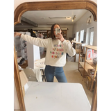 Cream-colored long-sleeved sweatshirt with good ole days reversed lettering