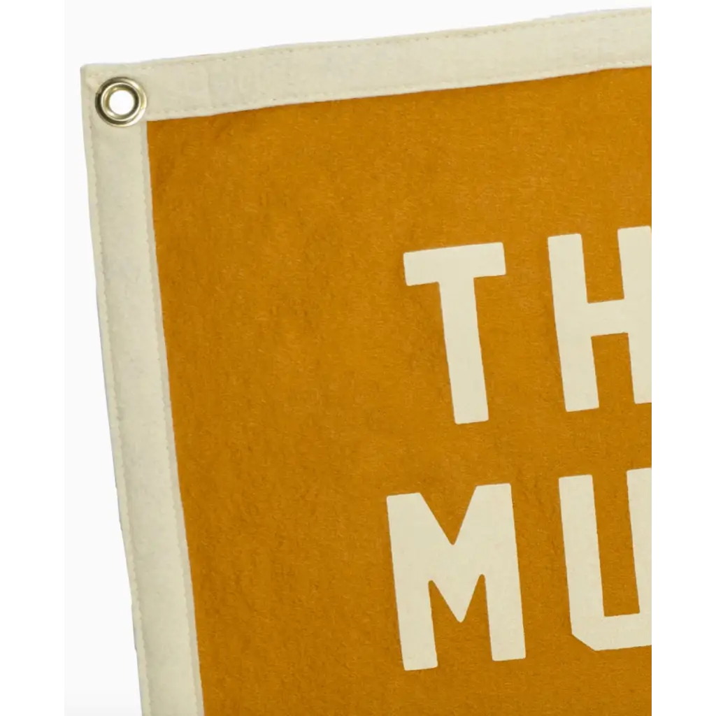 Mustard-colored felt banner with white trim for This Must Be the Place Camp Flag, perfect for stylish women’s clothes