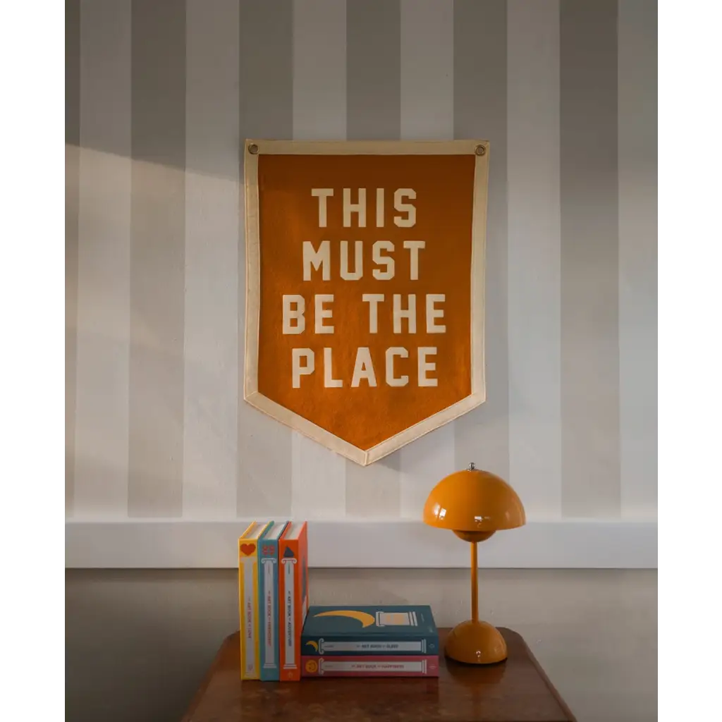 Orange pennant with white lettering for This Must Be the Place Camp Flag, stylish for moms