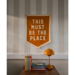 Orange pennant with white lettering for This Must Be the Place Camp Flag, stylish for moms