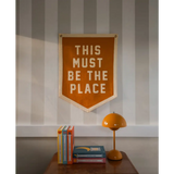 Orange pennant with white lettering for This Must Be the Place Camp Flag, stylish for moms