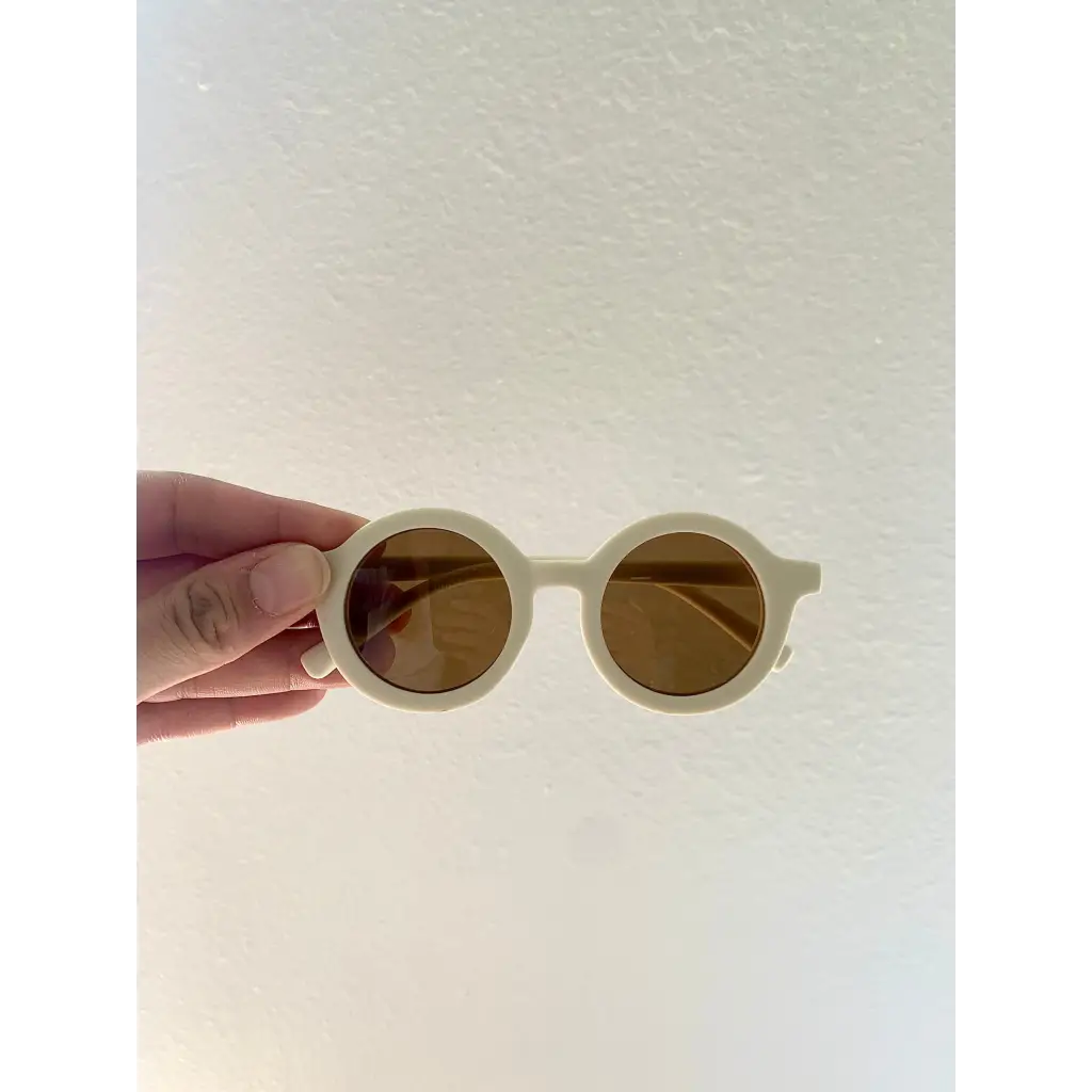 Cream-colored round retro sunglasses for babies and toddlers with brown lenses