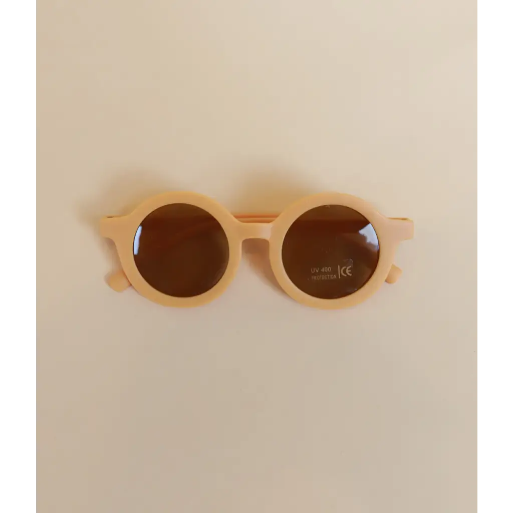 Pastel Round Retro Sunglasses for Babies and Toddlers with peach frames and brown lenses