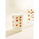 Clear glass cup with red berry pattern and white milk, perfect for stylish womens clothes