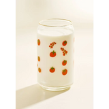 Glass can-shaped tumbler with fruit pattern and white drink, perfect for stylish womens clothes