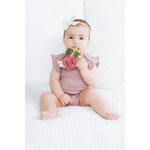 Baby pink floral romper with crinkle teether beaded ring