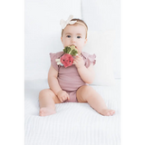Baby pink floral romper with crinkle teether beaded ring