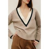 Stylish womens clothes: woman in Varsity Contrast Deep V Neck Sweater with satin pants