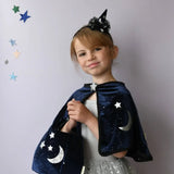 Young girl in Velvet Twilight Cauldron Bag with polished prints, perfect for stylish womens clothes