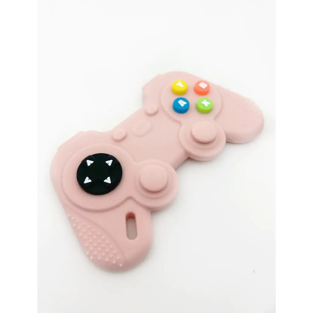 Pink video game controller teether helps soothe baby’s gums with colorful buttons