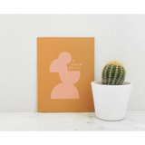 Orange card with pink silhouette next to a barrel cactus, perfect for sending thoughtful notes