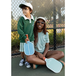 Two pickleball players in Wave Wash Fleece Shorts enjoying a casual game together