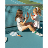 Two friends having fun playing a clapping game in Wave Wash Fleece Shorts