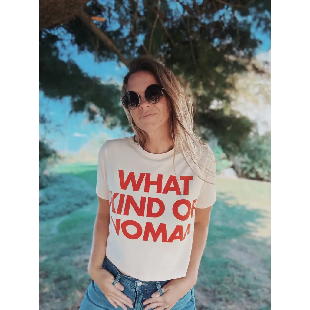 Beige mom crop t-shirt with bold red what kind of woman text and sunglasses