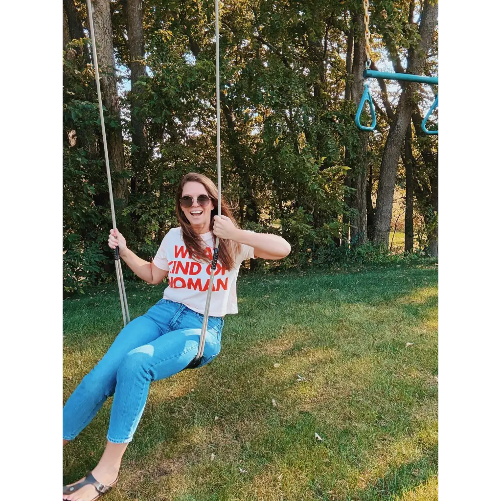 Mom crop t-shirt in white with red wanderlust text and blue jeans