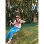 Mom crop t-shirt in white with red wanderlust text and blue jeans