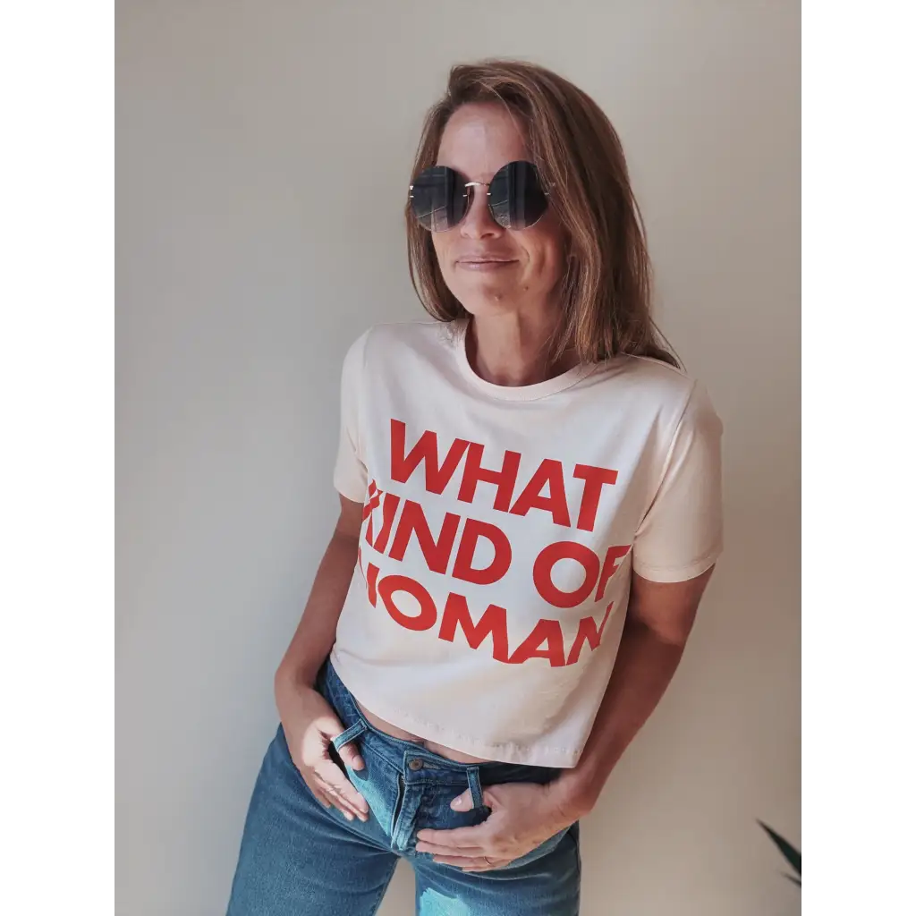 Cream-colored mom crop tee with Kate Baers what kind of woman text and distressed jeans