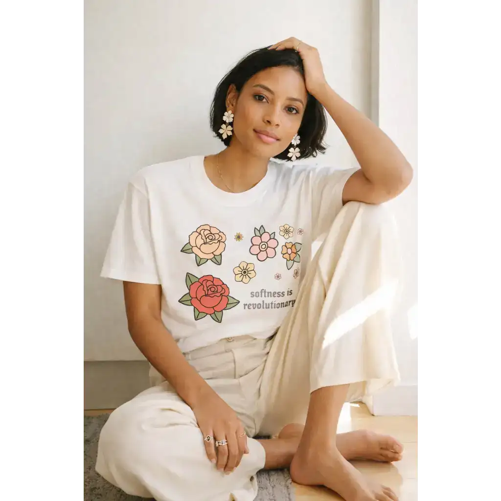 Oversized unisex tee with cotton comfort floral print and Softness is Revolutionary text