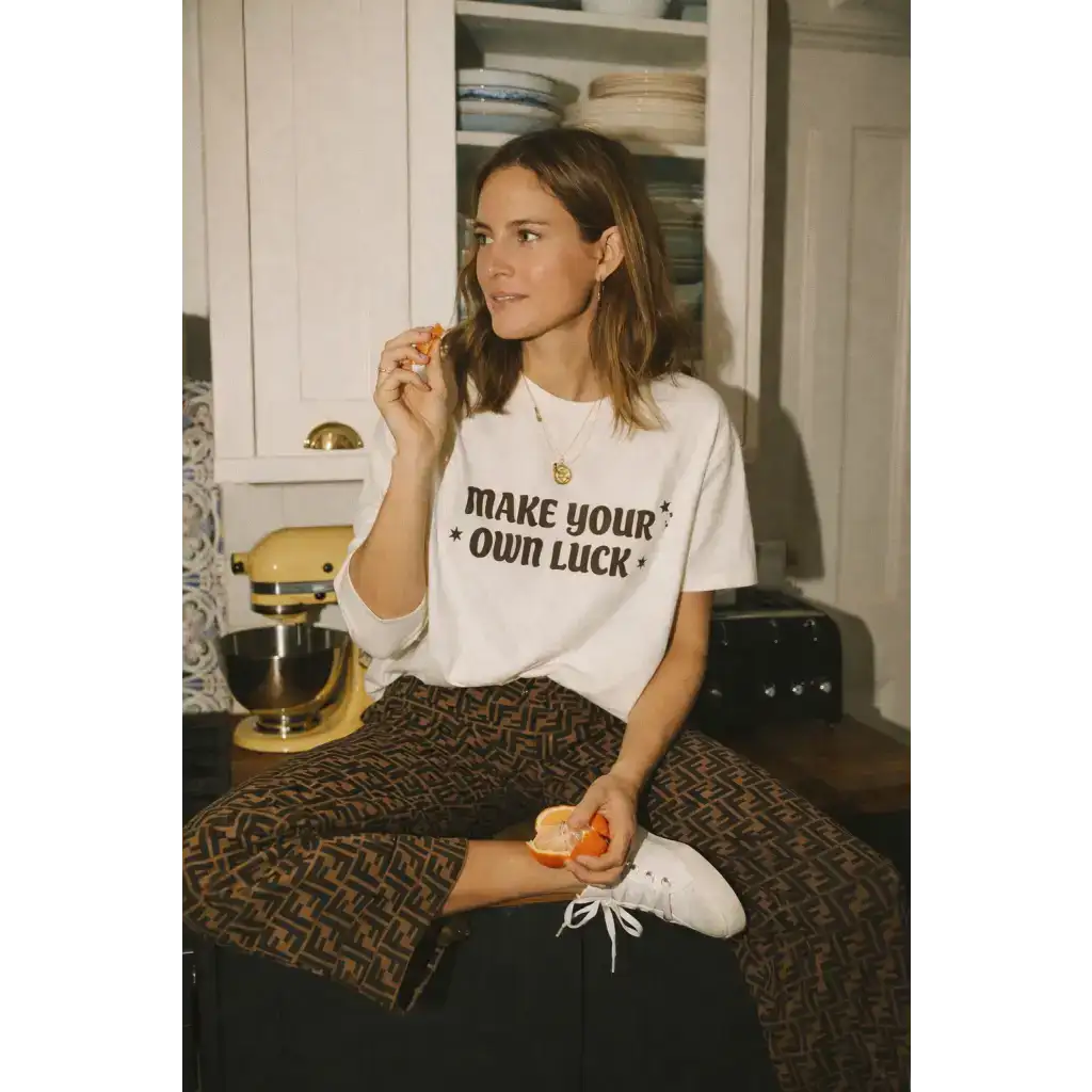 White oversized unisex tee with Make Your Own Luck graphic in cotton comfort