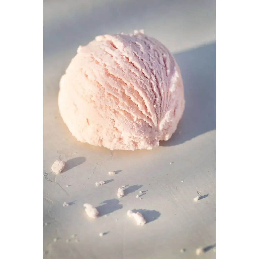 Pink strawberry bath truffle scoop with swirls and sprinkles