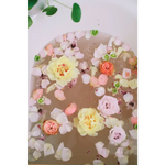 Serene WildFlora bath salts tub with pink yellow peach petals