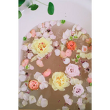 Serene WildFlora bath salts tub with pink yellow peach petals
