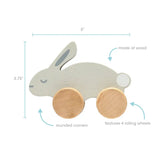 Cute 5-inch wooden bunny push toy with pink ears and rolling wheels