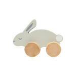 Charming wooden bunny push toy with gold wheels and white accents